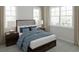 Comfortable bedroom featuring a bed with plush bedding, soft lighting, and neutral decor at 947 Willingham Dr # 2, Hapeville, GA 30354