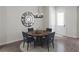 Cozy dining area featuring a round wooden table, stylish chairs, and modern chandelier at 947 Willingham Dr # 2, Hapeville, GA 30354