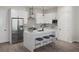 Modern kitchen with white cabinets, stainless steel appliances, quartz countertops, and stylish stools at 947 Willingham Dr # 2, Hapeville, GA 30354
