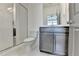 Bathroom featuring a glass enclosed shower, a modern vanity, and neutral tile floors at 1273 Harvest Park Ln, Suwanee, GA 30024
