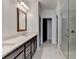 Spacious bathroom with double vanity, tiled floors, and a glass-enclosed shower at 1273 Harvest Park Ln, Suwanee, GA 30024