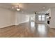 Open living room with hardwood floors and lots of natural light at 1273 Harvest Park Ln, Suwanee, GA 30024