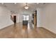 Open floor plan with hardwood floors shows kitchen and living space at 1273 Harvest Park Ln, Suwanee, GA 30024