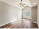 Bright bedroom with hardwood flooring, a high ceiling, and a window allowing natural light at 1843 Broad River Rd, Atlanta, GA 30349