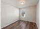 Cozy bedroom featuring a window allowing natural light and wood floors at 1843 Broad River Rd, Atlanta, GA 30349