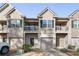 Townhome exterior showcasing private garages, entrances and upper-level balconies at 1843 Broad River Rd, Atlanta, GA 30349