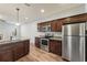 Open-concept kitchen showcases stainless steel appliances and granite countertops at 1843 Broad River Rd, Atlanta, GA 30349