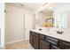 Bathroom showcasing a double sink vanity with a large mirror and modern fixtures at 405 Blue Sky Circle Cir, Acworth, GA 30102