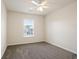 Bright bedroom featuring plush carpeting and a window with a view of the outdoors at 405 Blue Sky Circle Cir, Acworth, GA 30102