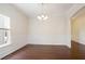 Elegant dining room boasts dark hardwood floors and decorative moldings at 405 Blue Sky Circle Cir, Acworth, GA 30102