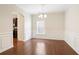 Elegant dining room features dark hardwood floors, decorative moldings, and a chandelier at 405 Blue Sky Circle Cir, Acworth, GA 30102