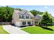 Traditional two-story home with lush front lawn, driveway, and inviting curb appeal at 405 Blue Sky Circle Cir, Acworth, GA 30102