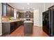Kitchen boasts granite countertops, dark wood cabinets, and a center island at 405 Blue Sky Circle Cir, Acworth, GA 30102