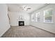 Carpeted living room with a fireplace and plenty of natural light at 405 Blue Sky Circle Cir, Acworth, GA 30102