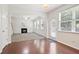 Spacious living room with fireplace, windows, and access to outdoor patio at 405 Blue Sky Circle Cir, Acworth, GA 30102