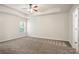Bright main bedroom featuring a tray ceiling at 405 Blue Sky Circle Cir, Acworth, GA 30102