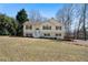 Charming two-story home with light yellow siding, dark shutters, and a well-maintained front lawn at 4312 Daniel Dr, Winston, GA 30187