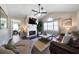Cozy living room features hardwood floors, a fireplace, ceiling fan, and large window for natural light at 4312 Daniel Dr, Winston, GA 30187
