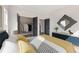 Comfortable bedroom with walk-in closet, modern decor, and neutral tones at 945 Willingham Dr # 3, Hapeville, GA 30354