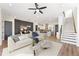 Open-concept living space featuring a modern sofa, dining area, and a stylish kitchen with an island at 945 Willingham Dr # 3, Hapeville, GA 30354
