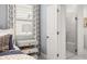 Bright bathroom with a glass-enclosed shower, black-and-white curtains, and a double drawer nightstand at 98 Keown Loop, Sharpsburg, GA 30277