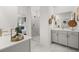 Stylish bathroom with a quartz countertop, seamless glass shower door, and an opening to the Primary bedroom at 98 Keown Loop, Sharpsburg, GA 30277