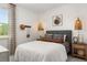Comfortable bedroom featuring soft lighting, a stylish headboard, and ample natural light at 98 Keown Loop, Sharpsburg, GA 30277