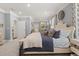Spacious bedroom features a large bed, plush pillows, neutral color palette and windows with natural light at 98 Keown Loop, Sharpsburg, GA 30277