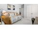 Cozy bedroom with ample natural light, neutral decor and comfortable seating area at 98 Keown Loop, Sharpsburg, GA 30277