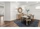 Bright dining room with white wainscoting, modern decor, and seating for four at 98 Keown Loop, Sharpsburg, GA 30277