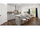 Modern kitchen with white cabinets, a large island, and stainless steel appliances at 98 Keown Loop, Sharpsburg, GA 30277