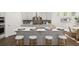 Contemporary kitchen with a central island, ample counter space, and stylish bar stools at 98 Keown Loop, Sharpsburg, GA 30277