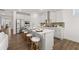 Modern kitchen with stainless steel appliances, an island with seating, and white cabinets at 98 Keown Loop, Sharpsburg, GA 30277