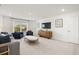 Bright living room features modern decor and comfortable seating arrangement at 98 Keown Loop, Sharpsburg, GA 30277
