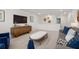 Spacious living room with neutral tones, modern furniture, and an inviting layout at 98 Keown Loop, Sharpsburg, GA 30277