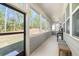 Sunroom features great natural light with multiple windows offering great views of the exterior landscape at 98 Keown Loop, Sharpsburg, GA 30277