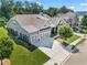 Expansive aerial view of home with three-car garage, green lawn, and mature trees at 105 Laurel Canyon Trl, Canton, GA 30114
