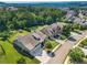 Aerial view of a home with manicured lawns, mature trees, and a neighborhood setting at 105 Laurel Canyon Trl, Canton, GA 30114