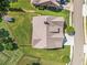 Aerial view showing a home's roof, large backyard, and the surrounding neighborhood at 105 Laurel Canyon Trl, Canton, GA 30114