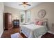 Cozy bedroom featuring natural light from the windows and a decorative accent wall at 105 Laurel Canyon Trl, Canton, GA 30114
