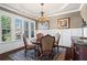 Elegant dining room with hardwood floors, classic chandelier, and large windows at 105 Laurel Canyon Trl, Canton, GA 30114