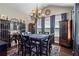 Spacious dining room featuring a wine rack, chandelier, and large windows at 105 Laurel Canyon Trl, Canton, GA 30114