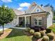 Charming home with stone accents, manicured landscaping, and a well-maintained lawn at 105 Laurel Canyon Trl, Canton, GA 30114
