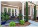 Inviting front porch with stone details, seating, and landscaping adding to the curb appeal at 105 Laurel Canyon Trl, Canton, GA 30114