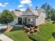 Inviting single-Gathering home with a two-car garage, manicured landscaping, and a welcoming front porch at 105 Laurel Canyon Trl, Canton, GA 30114