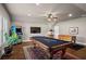 Game room boasts billiards table, foosball table, and arcade game, perfect for entertaining at 105 Laurel Canyon Trl, Canton, GA 30114