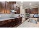 Gourmet kitchen with granite counters, stainless appliances, custom cabinets, and a modern backsplash at 105 Laurel Canyon Trl, Canton, GA 30114
