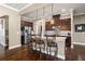 Beautiful kitchen featuring a center island with bar stools, stainless steel refrigerator, and modern lighting at 105 Laurel Canyon Trl, Canton, GA 30114