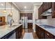 Gourmet kitchen featuring granite countertops, stainless steel appliances, and rich dark wood cabinetry at 105 Laurel Canyon Trl, Canton, GA 30114