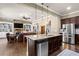 Open kitchen with granite island, stainless steel appliances, and seamless flow to the living area at 105 Laurel Canyon Trl, Canton, GA 30114